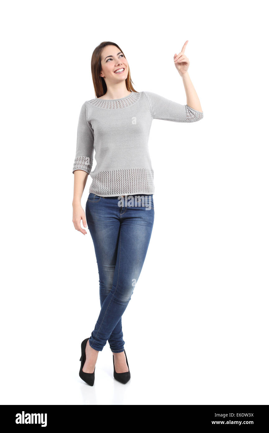 Full body of a standing casual woman pointing at side isolated on a white background Stock Photo