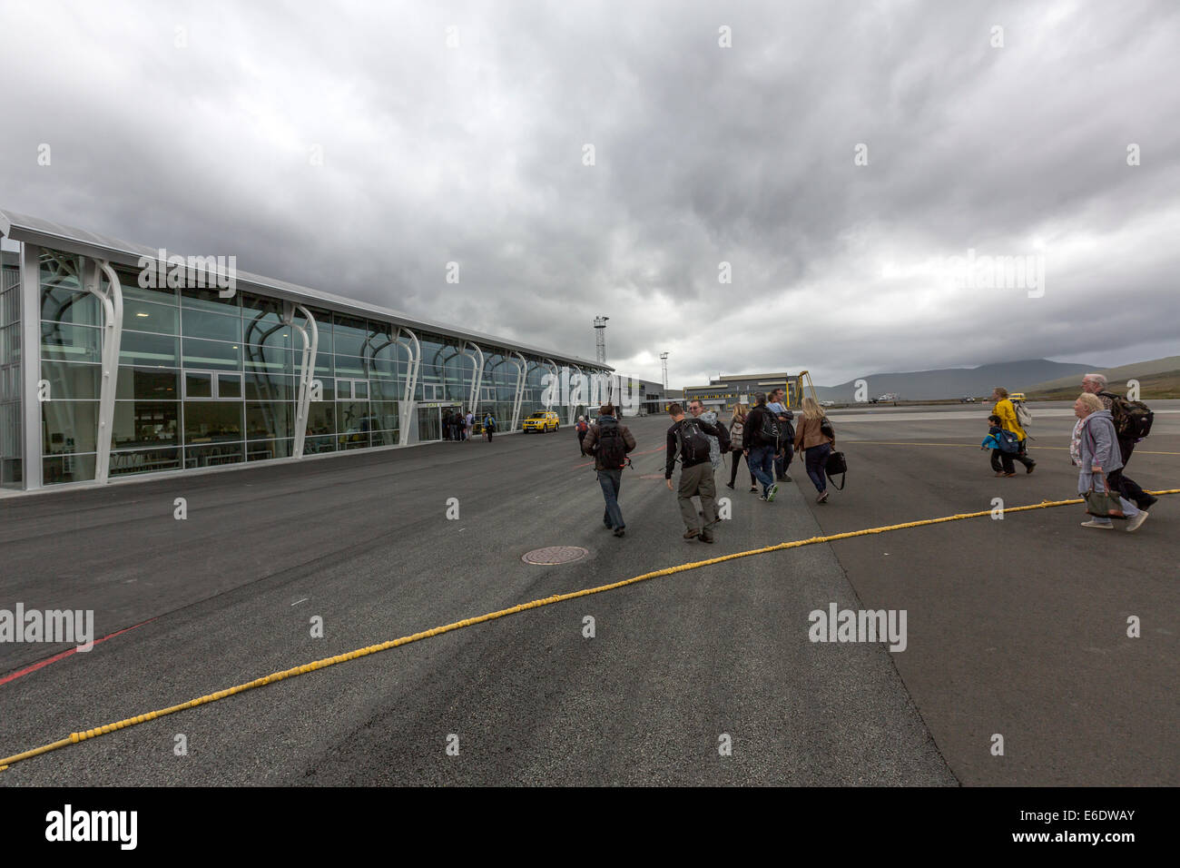 Passengers disembarking going to Vágar Airport terminal Stock Photo