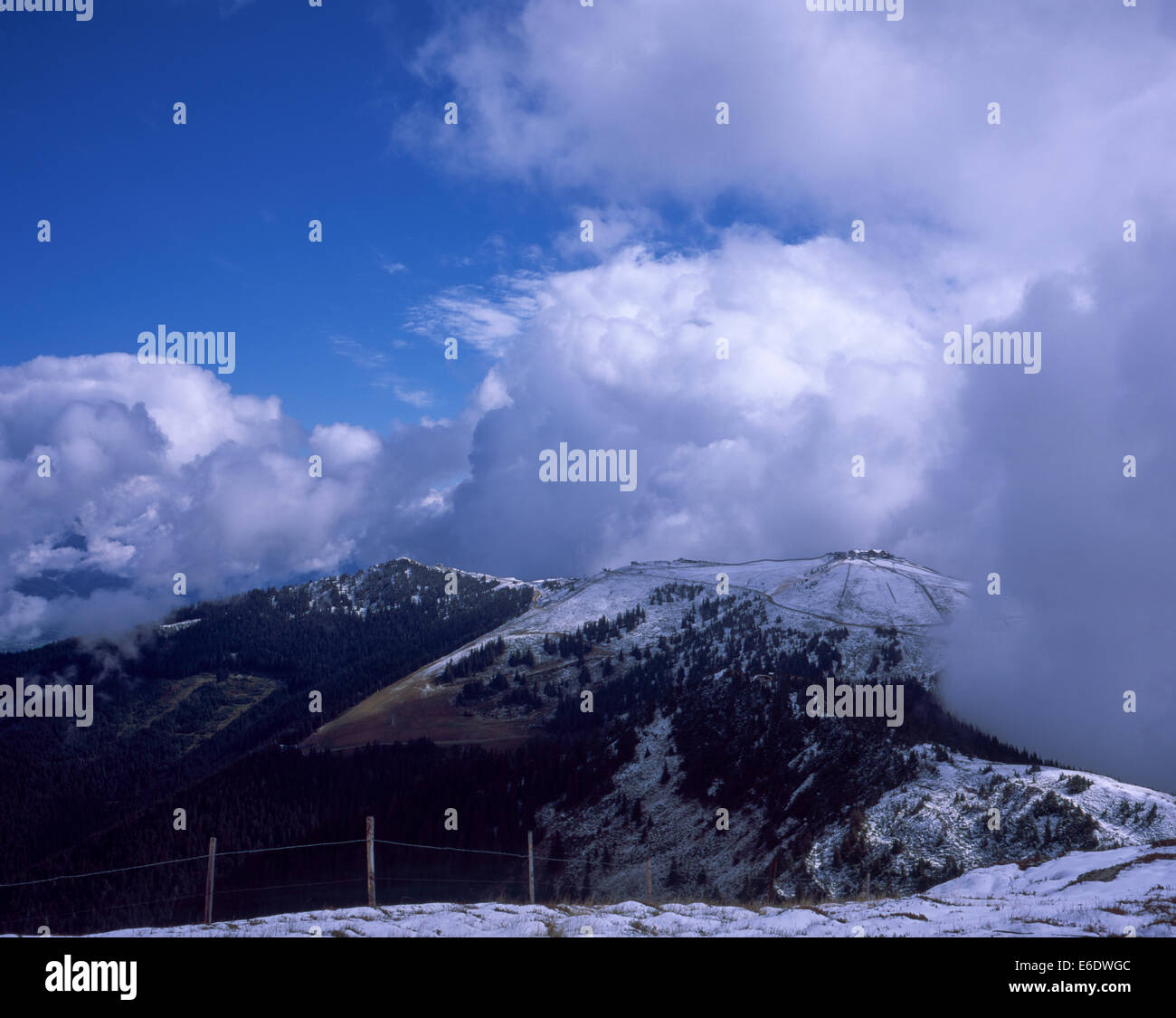 Cloud  mist and snow  on The Schmittenhohe & surrounding mountains  above Zell am See  Salzburgerland Austria Stock Photo