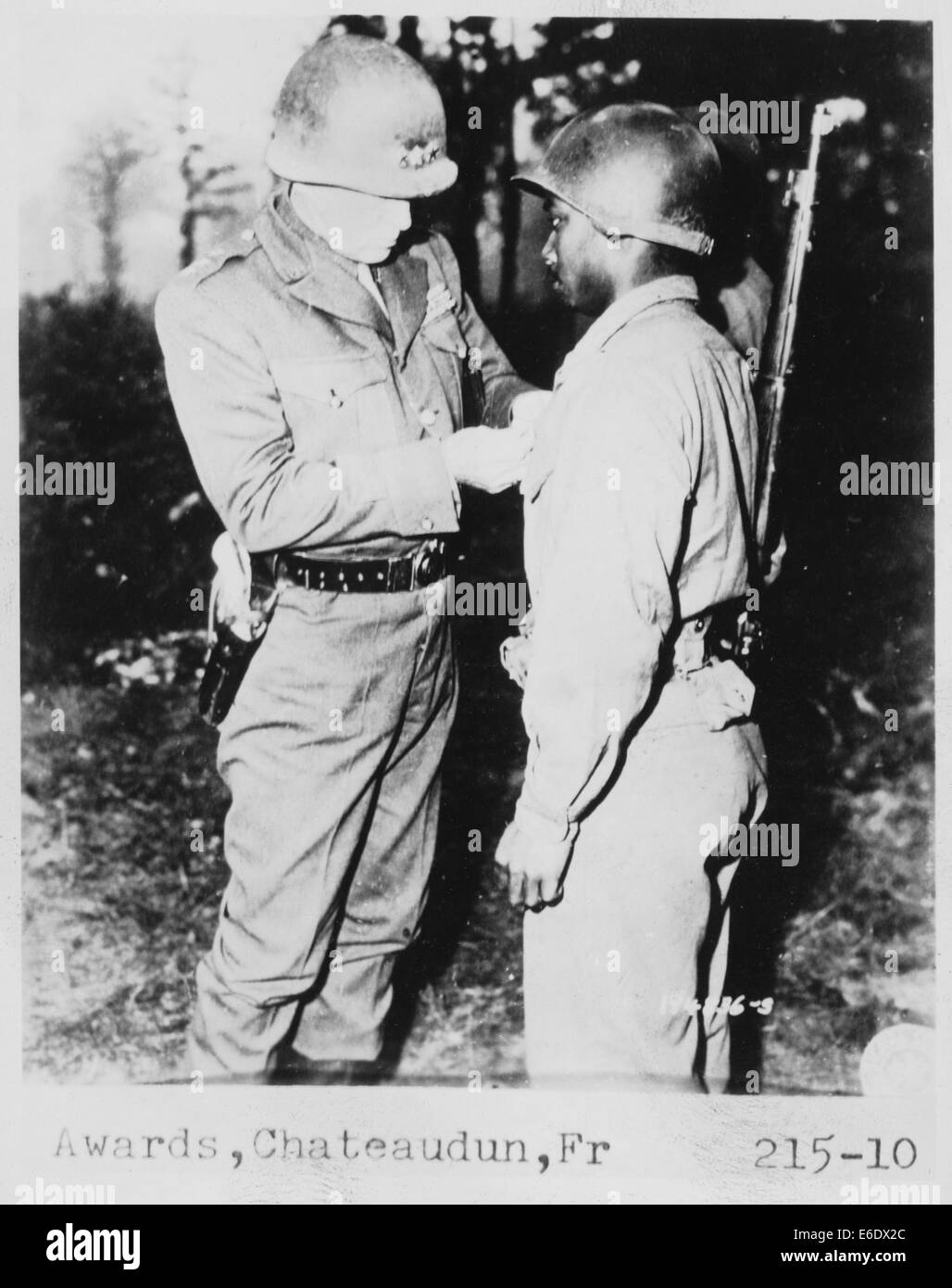 Lt. General George S. Patton Pins Silver Star on Private Ernest A. Jenkin after Liberation of Chateaudun, France, Oct. 13, 1944 Stock Photo