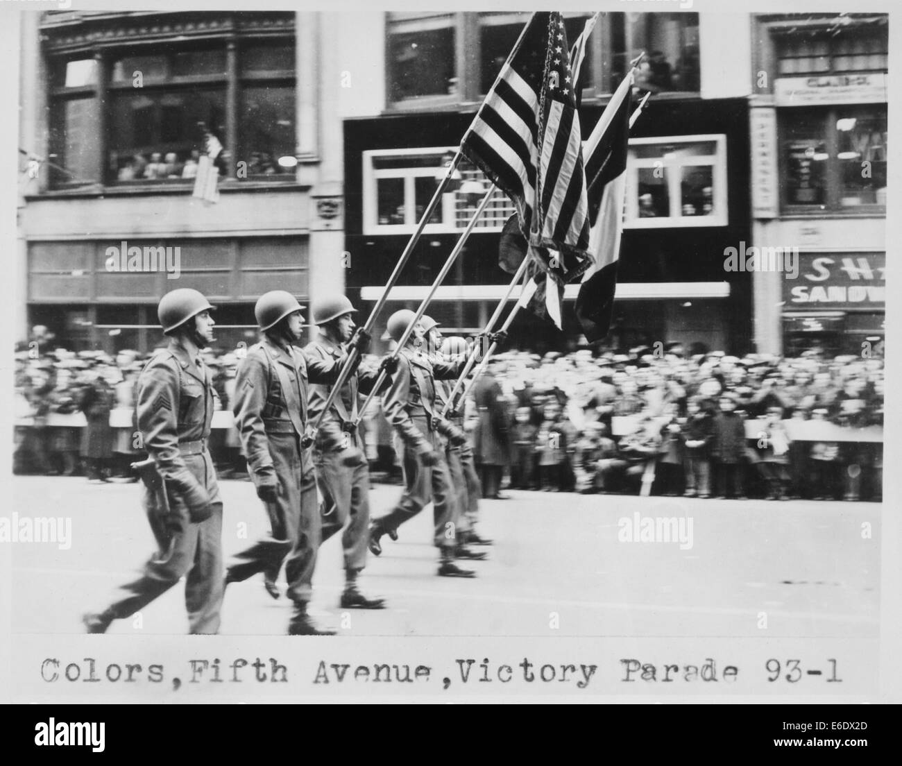 Row of Soldiers Marching with Flags During Victory Parade on Fifth Avenue, New York City, USA, 1946 Stock Photo