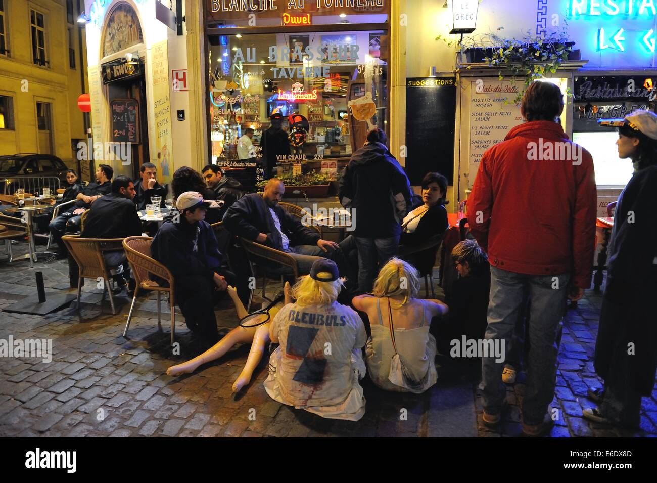 Drinkers sit an an outdoor cafe in Brussels, Belgium. Stock Photo