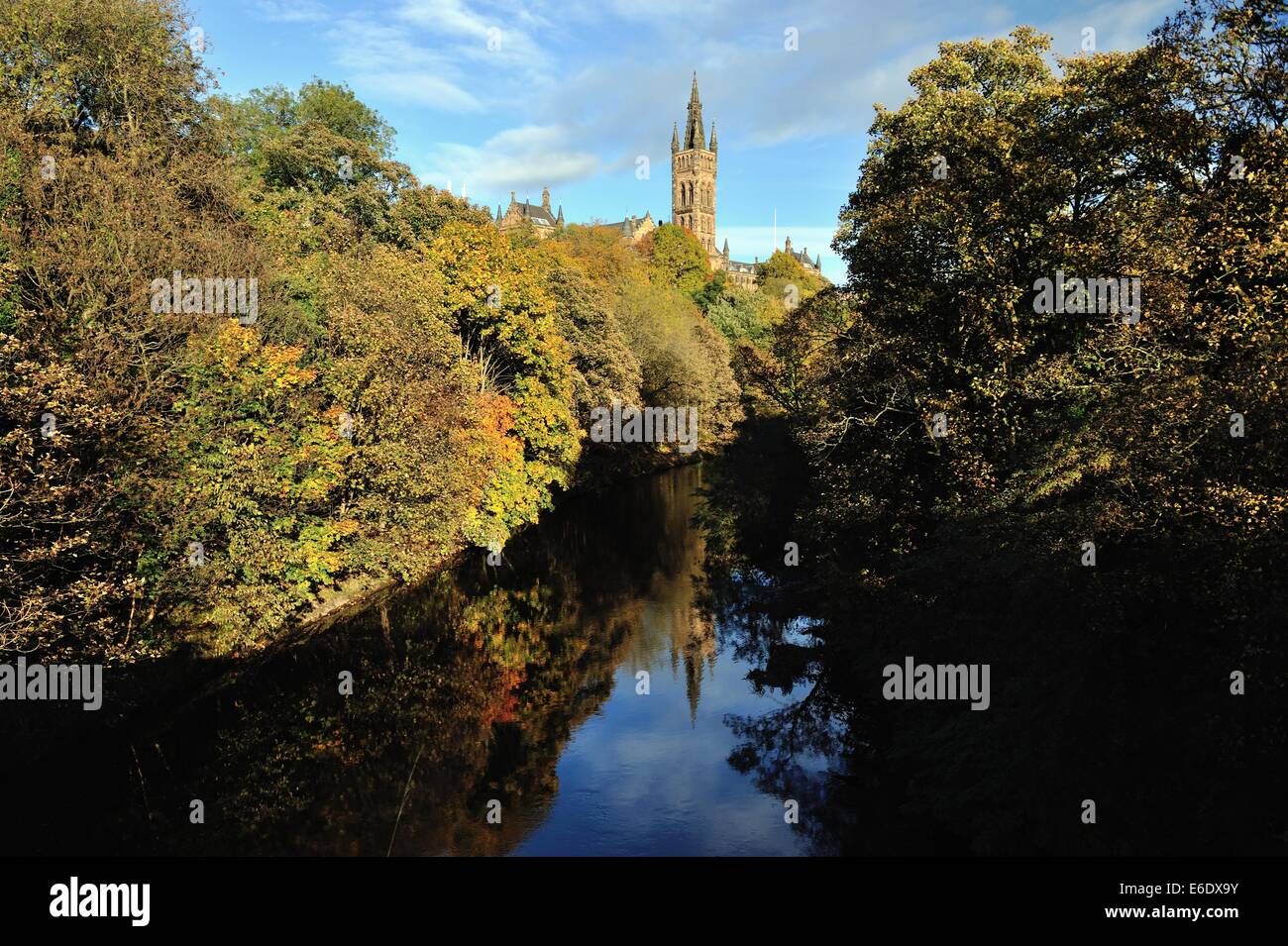 University of Glasgow bathed in autumn sunshine and reflected in the River Kelvin Stock Photo