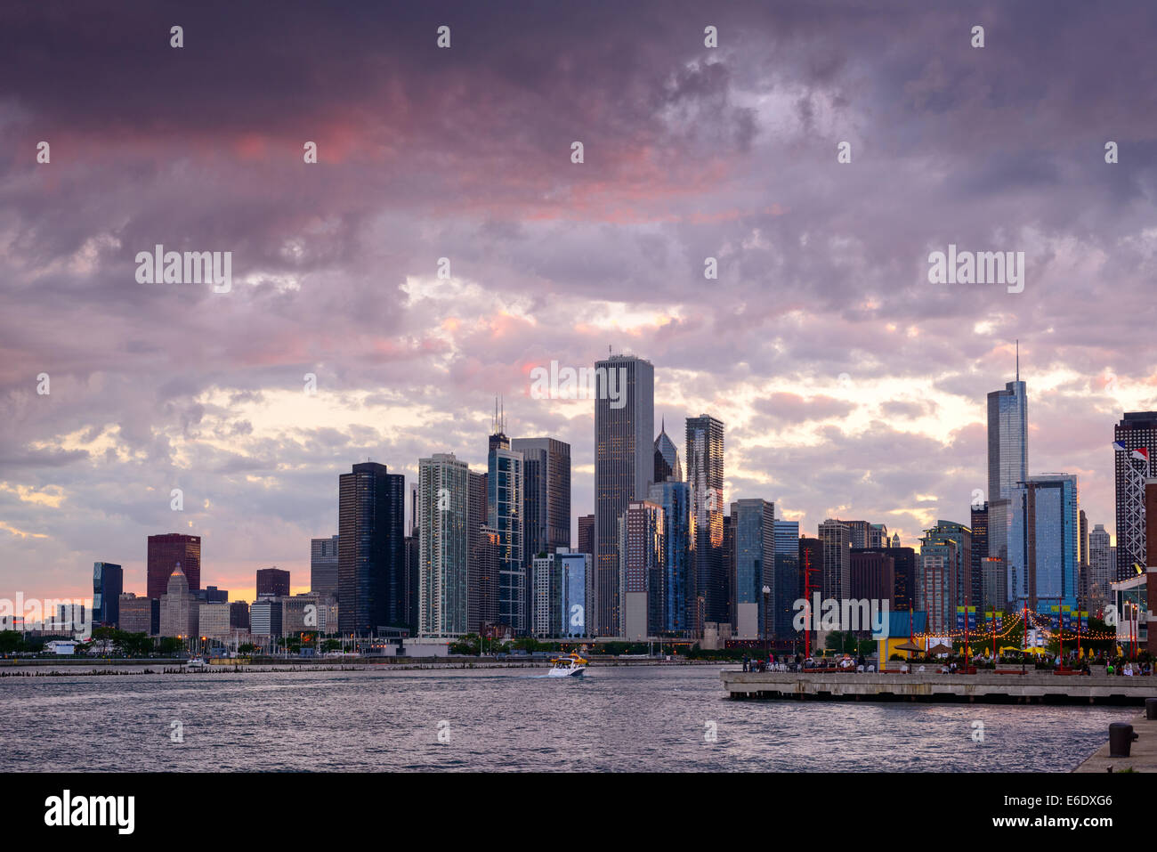 Photograph of the Chicago skyline under a dramatic sunset sky. Stock Photo