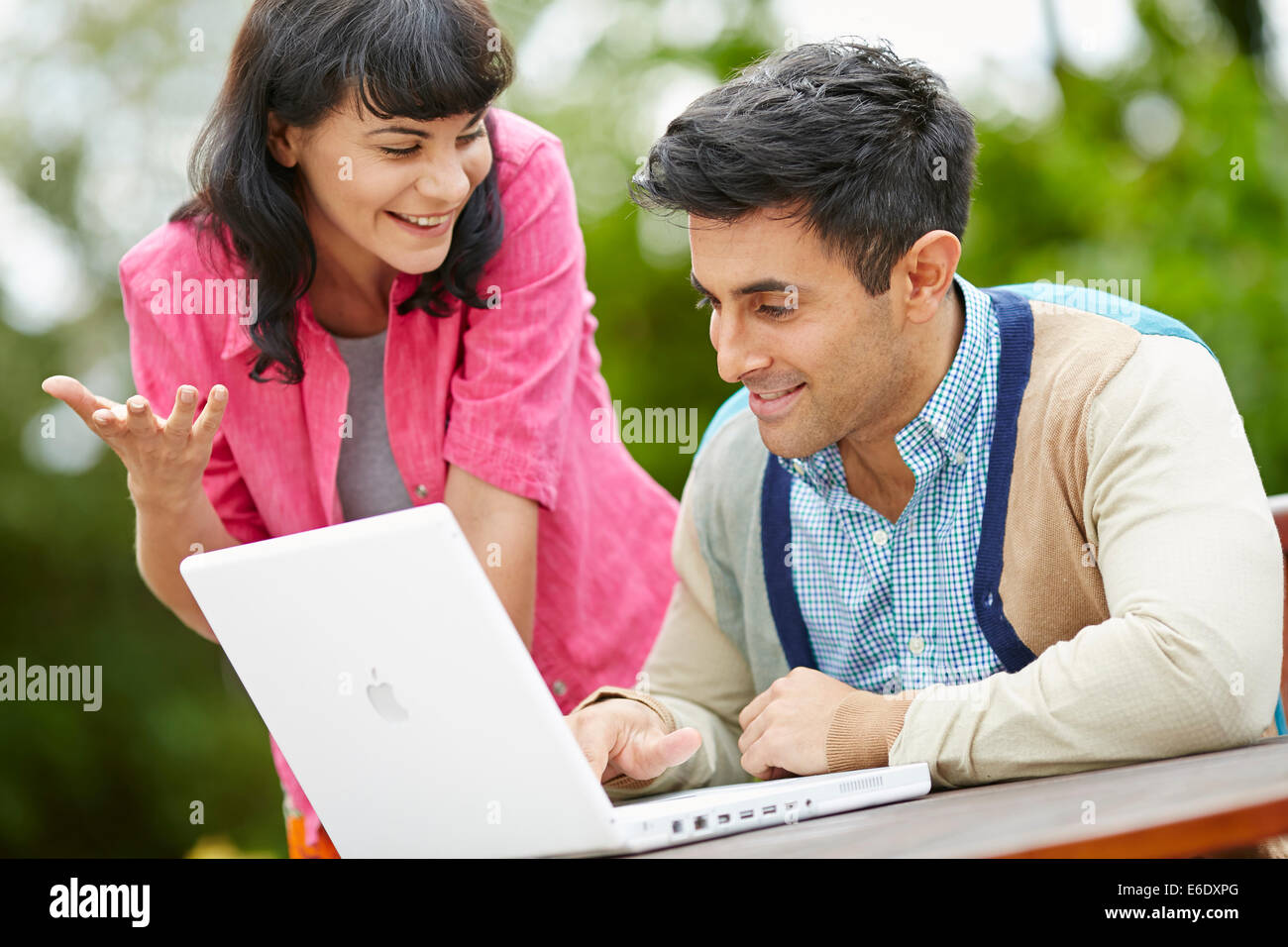 Couple browsing web using laptop Stock Photo