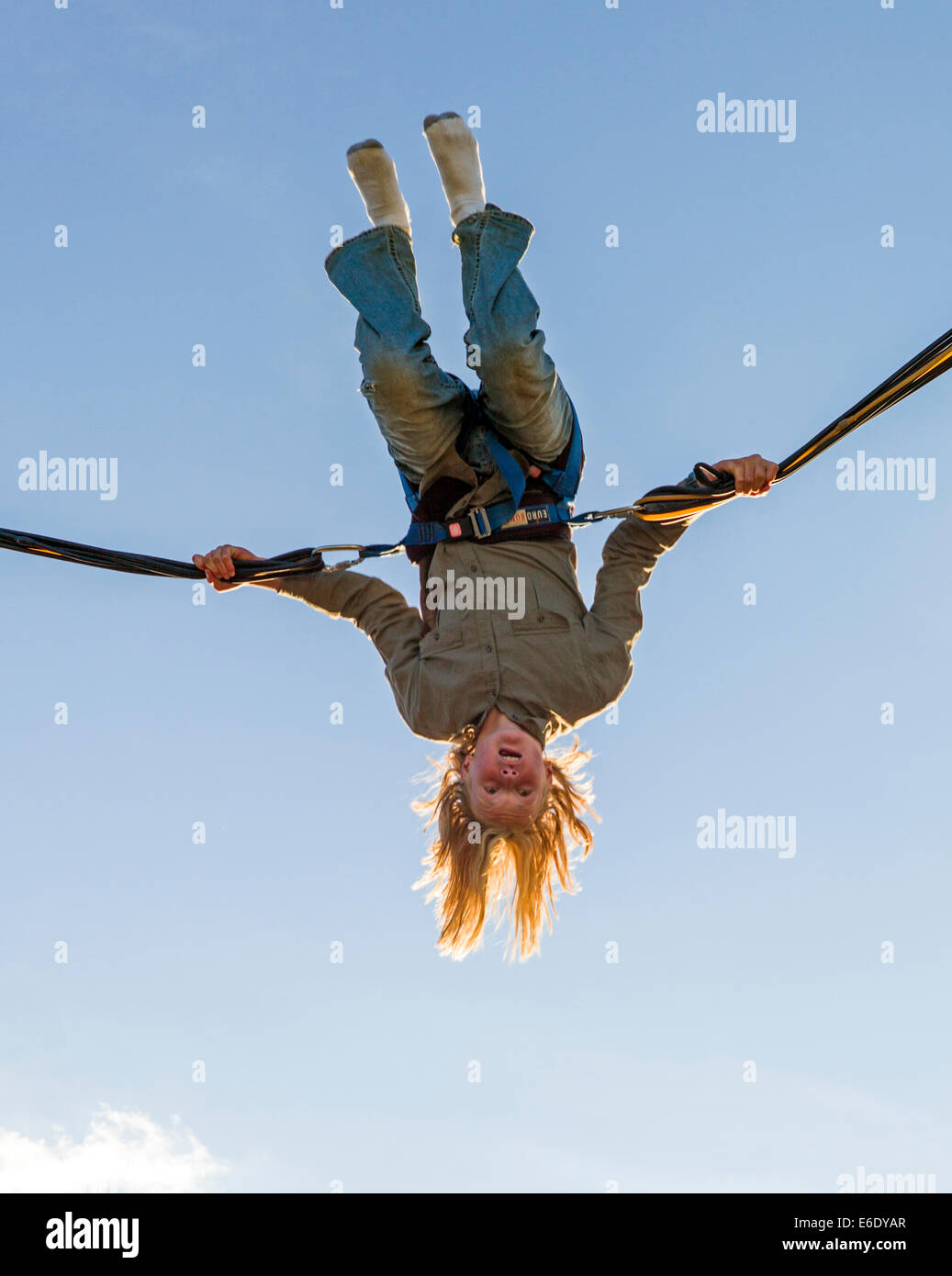 Children bounce on a Bungee Trampoline, Chaffee County Fair, Colorado, USA Stock Photo