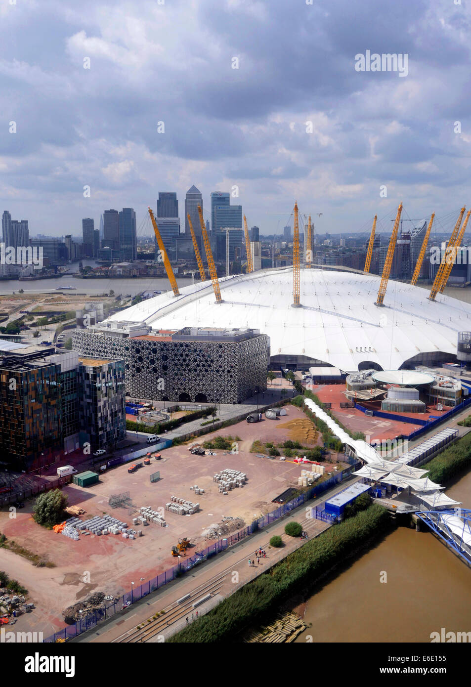 Aerial view of London Docklands and O2 arena from an Emirates Sky Train gondola car,  office towers in distance Stock Photo