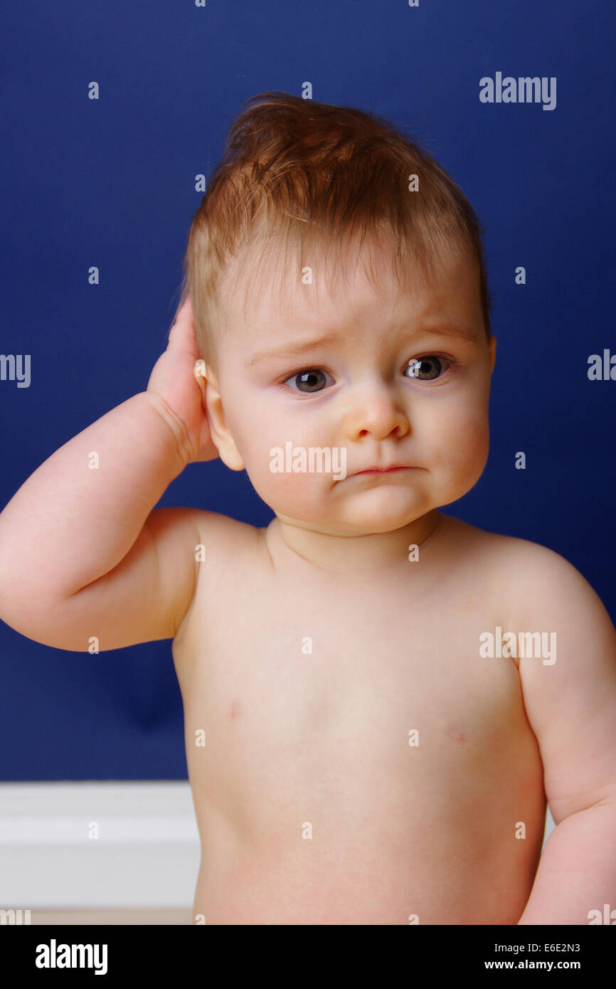 9 month old baby looking sad and forlorn Stock Photo Alamy