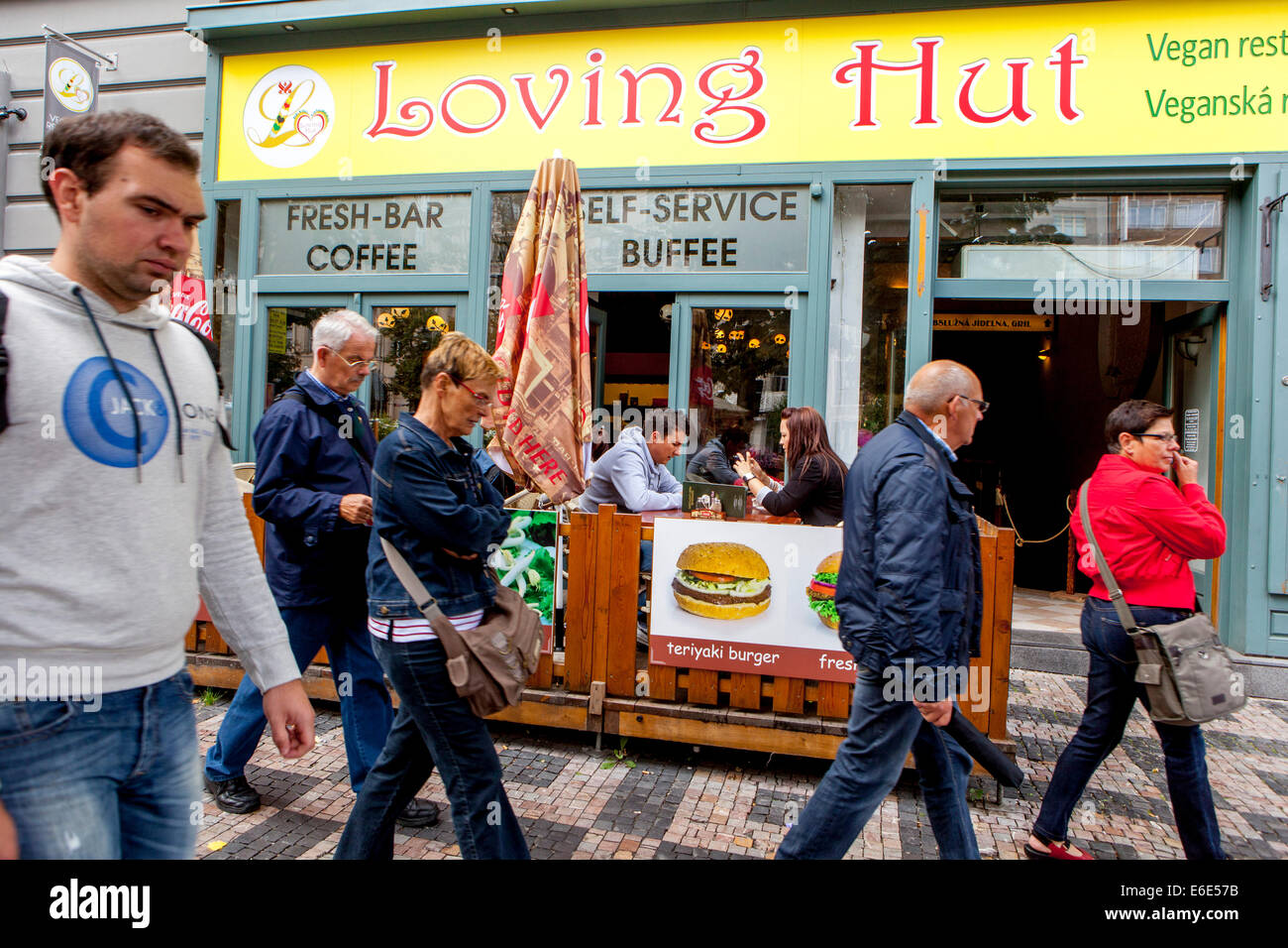 Tourists on Prague Wenceslas Square, sidewalk, Loving Hut, vegan restaurant Prague, Czech Republic,Europe Stock Photo