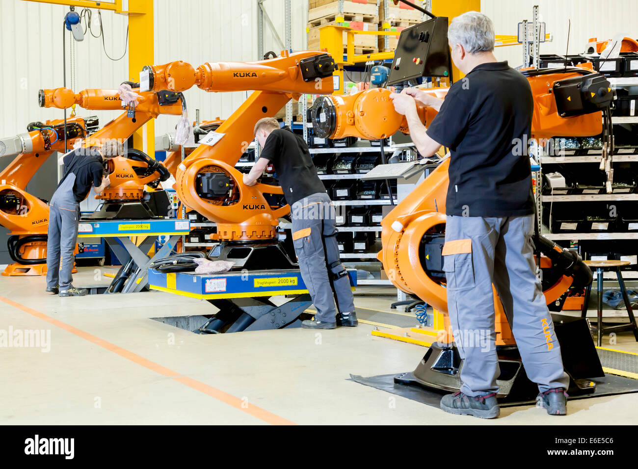 Employees of the robot manufacturer KUKA AG during the assembly of the electrical system of KUKA robots, Augsburg, Bavaria Stock Photo