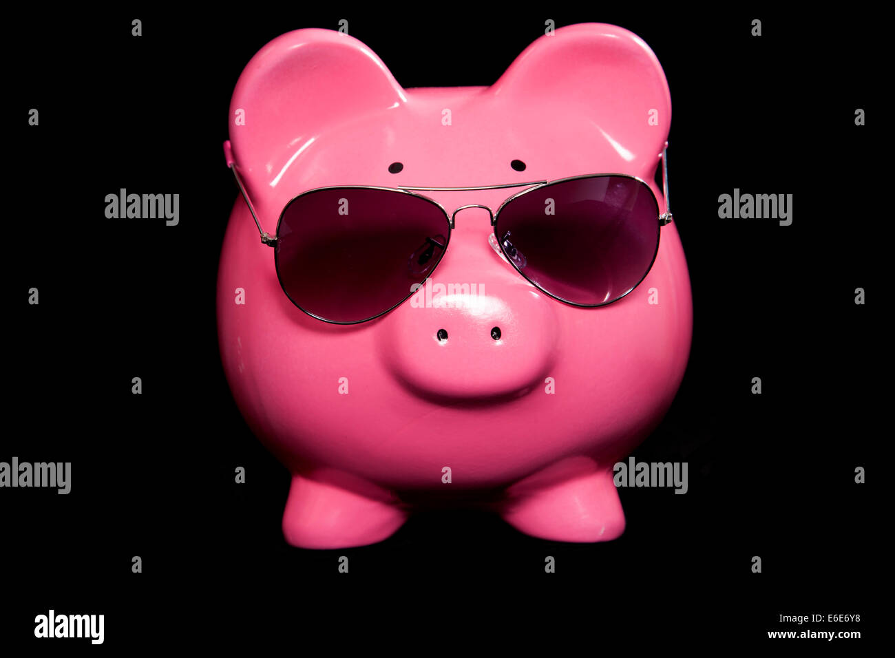 piggy bank with sunglasses studio cutout Stock Photo