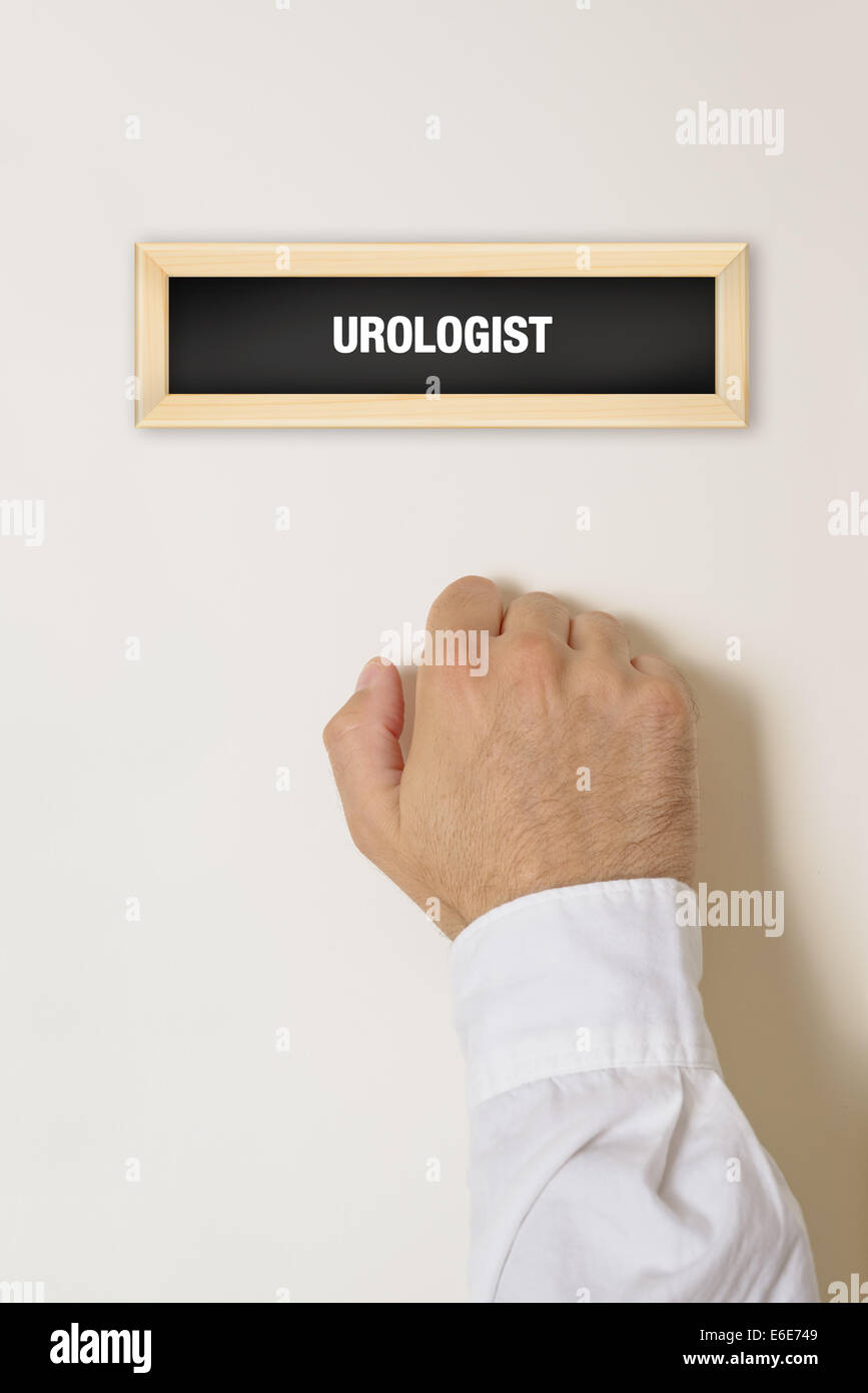 Male patient knocking on Urologist door for a medical exam. Stock Photo