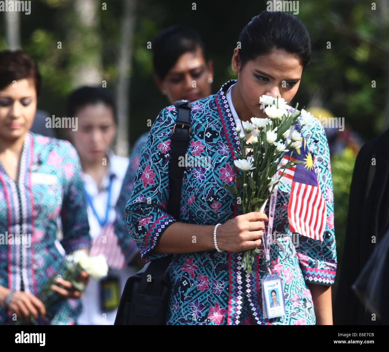 Sepang Selangor Malaysia 22nd Aug 2014 Malaysia Airlines Flight Attendants Gathered As A Convoy Of Hearses Carrying The Remains Of The Victims Of The Malaysia Airlines Flight Mh17 Plane Leave Bunga Raya
