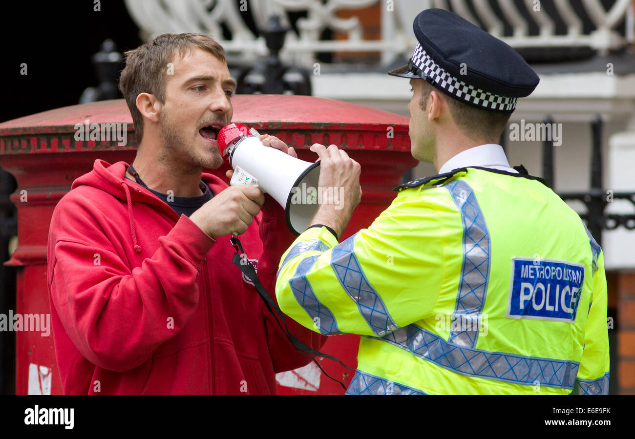 UK, London :  A police officer remonstrates with a protester on a street during a demonstration in London. 18.08.2014 Stock Photo