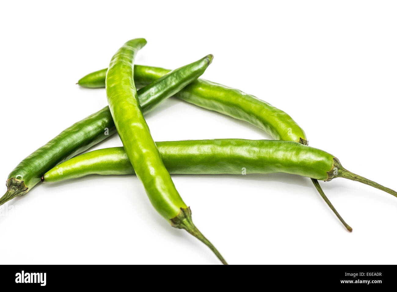 Green cayenne peppers on a white background Stock Photo Alamy