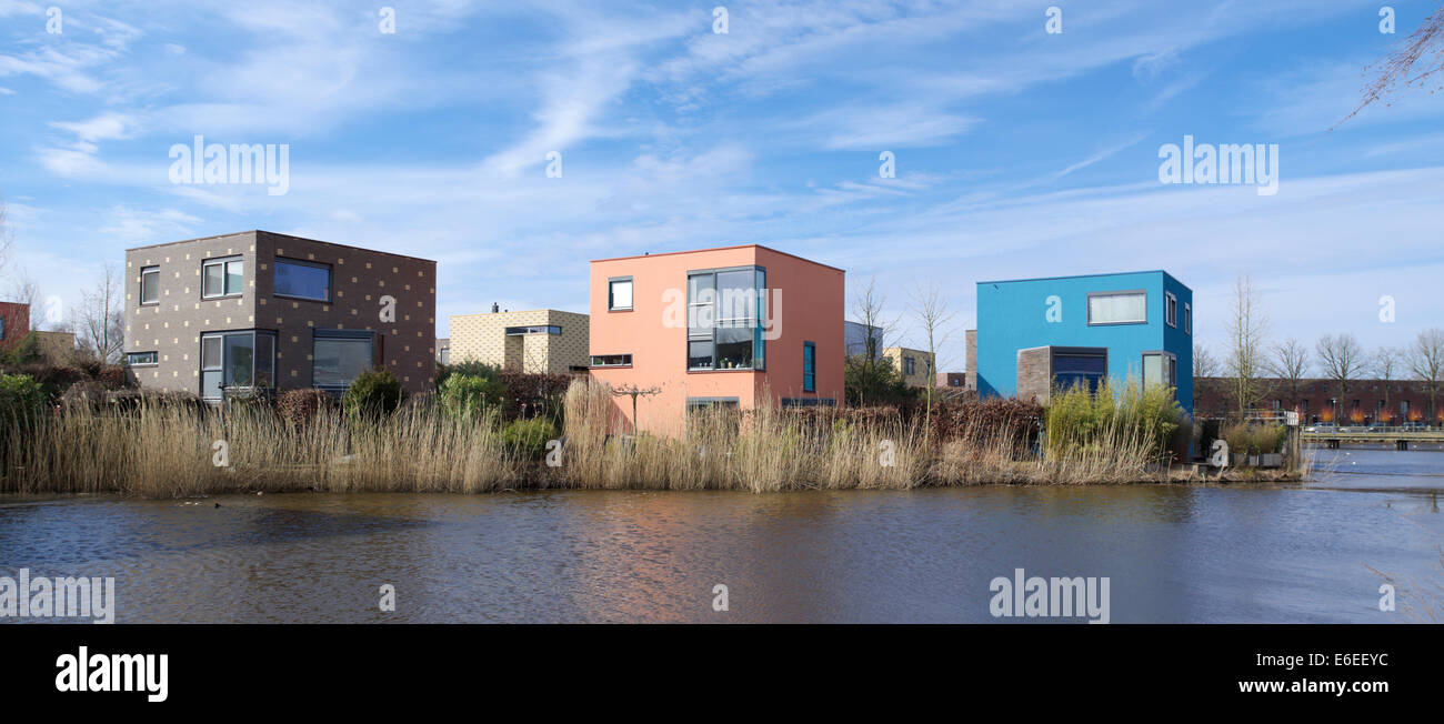 colorful houses at a small pond in enschede, netherlands Stock Photo