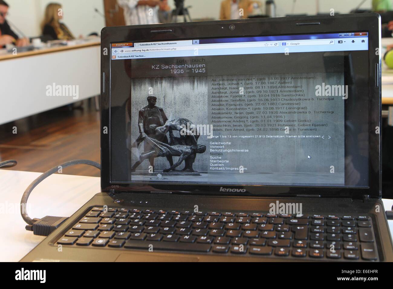 Potsdam, Germany. 22nd Aug, 2014. A laptop with names of the dead during a press conference for the opening of the online book of the dead with the names of 21,913 victims of Sachsenhausen Concentration Camp, in Potsdam, Germany, 22 August 2014. Photo: NESTOR BACHMANN/dpa/Alamy Live News Stock Photo