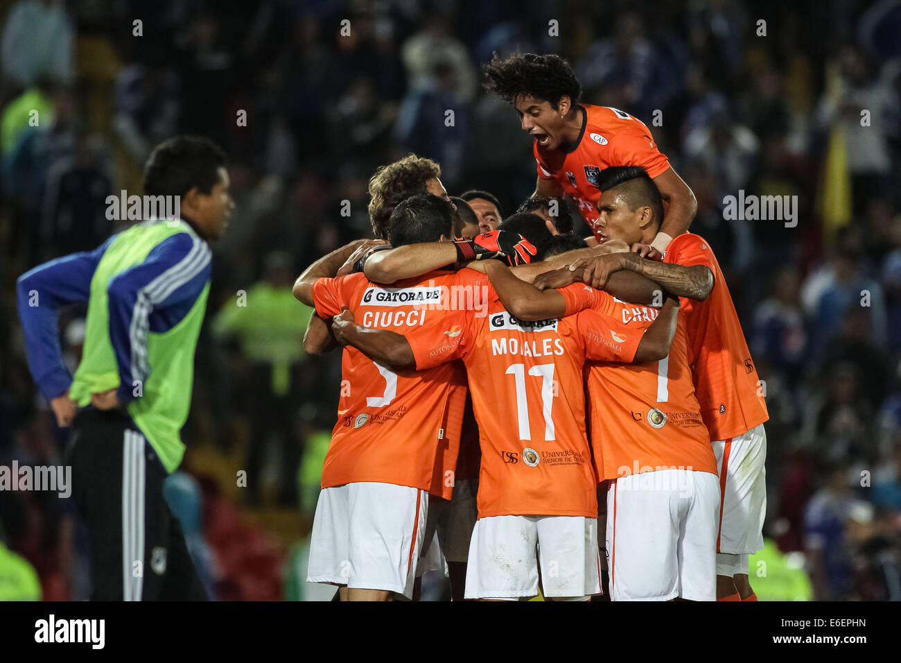 Bogota, Colombia. 21st Aug, 2014. Players of Cesar Vallejo of Peru celebrate after scoring during the match of the South American Cup, against Millonarios of Colombia, in Bogota, capital of Colombia, on Aug. 21, 2014. Credit:  Jhon Paz/Xinhua/Alamy Live News Stock Photo