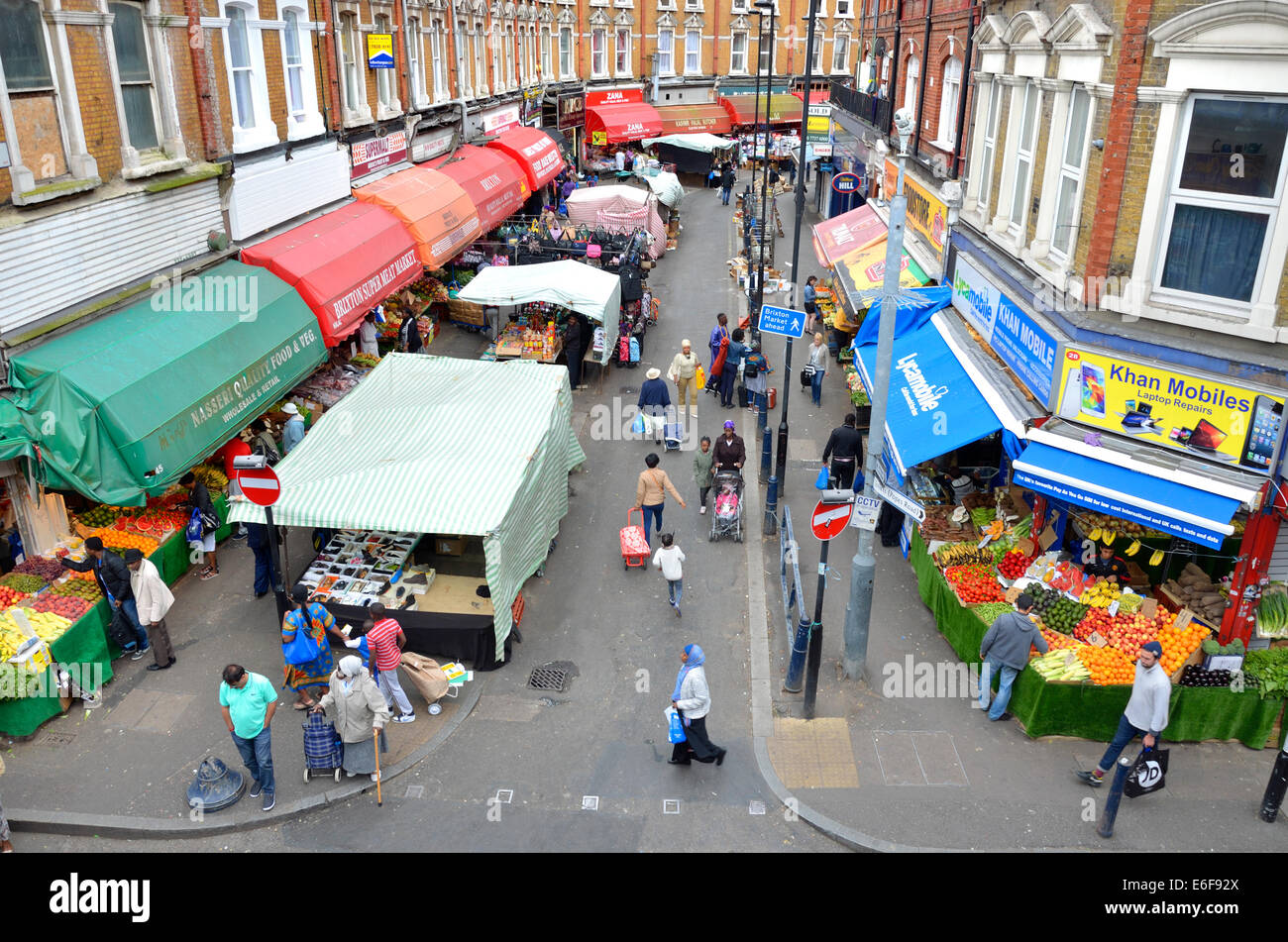 London, England, UK. Brixton market Electric Avenue, seen from the
