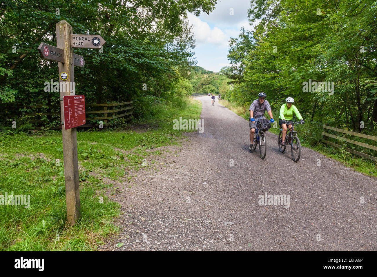 Cycling in the countryside. Cyclists on the Monsal Trail in Derbyshire, Peak District National Park, England, UK Stock Photo