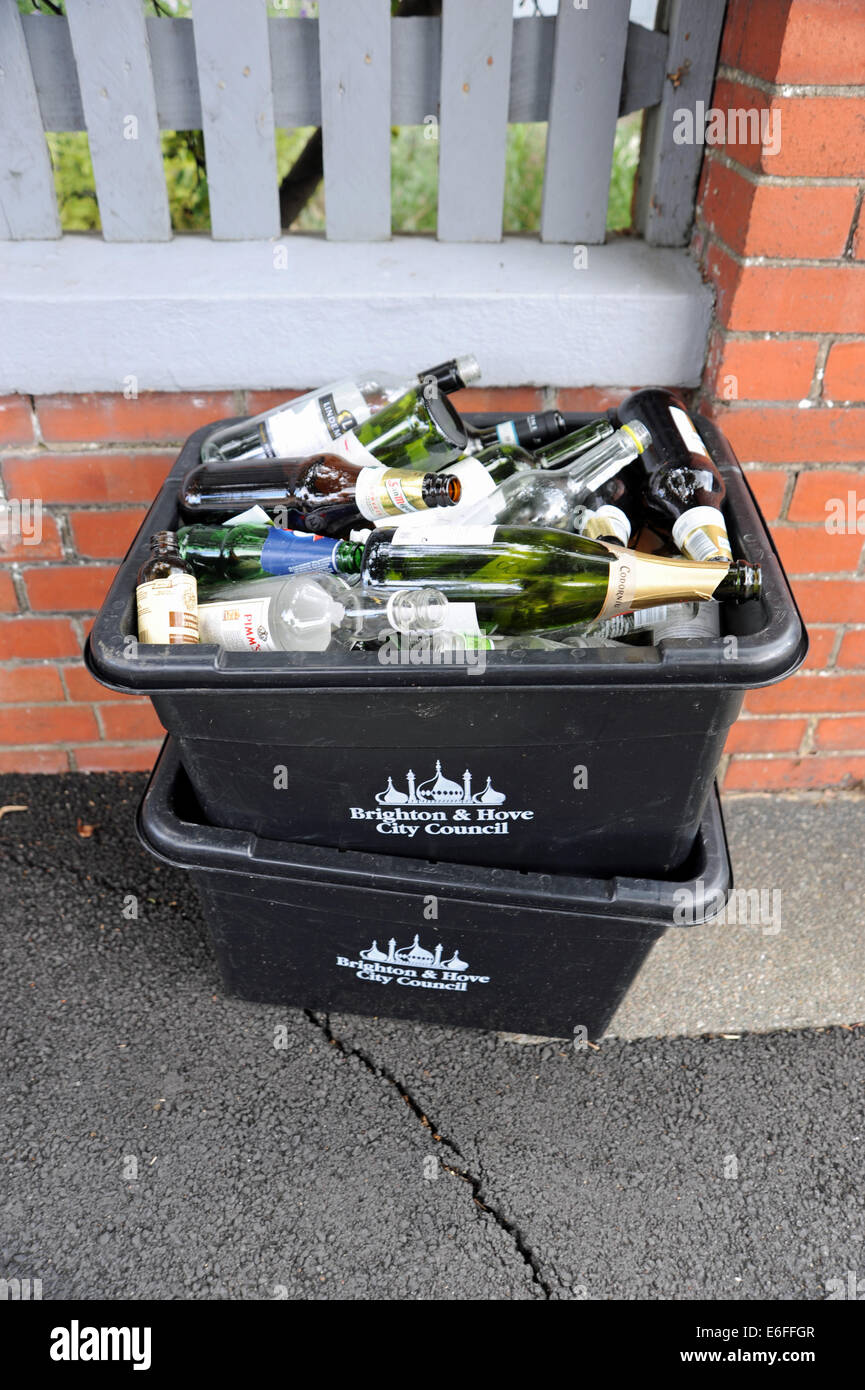 Brighton UK - Recycling boxes full of empty glass bottles for collection by Brighton and Hove City Council Stock Photo