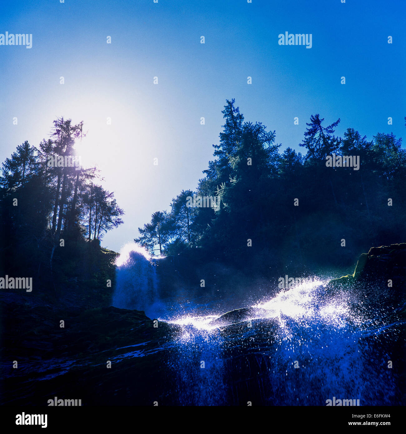 Cascade du Rouget waterfall and sun Savoy French Alps France Stock