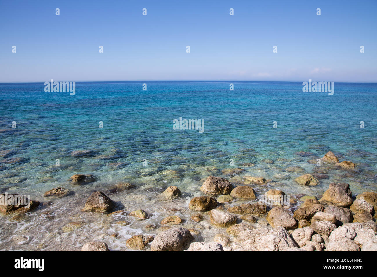 Mediterrean sea in Greece: Ocean background with coast, water and blue horizon. Greek islands. Stock Photo