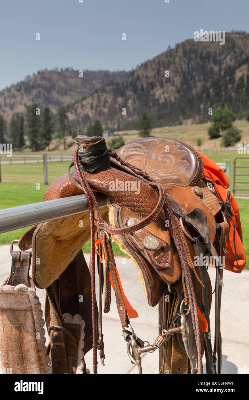 Tooled Leather Saddle on Hitching Post, Montana Stock Photo
