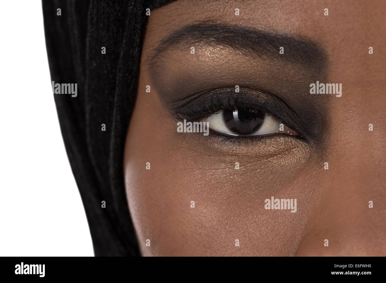 Beautiful black oriental colored woman face: eyes and beauty. Stock Photo