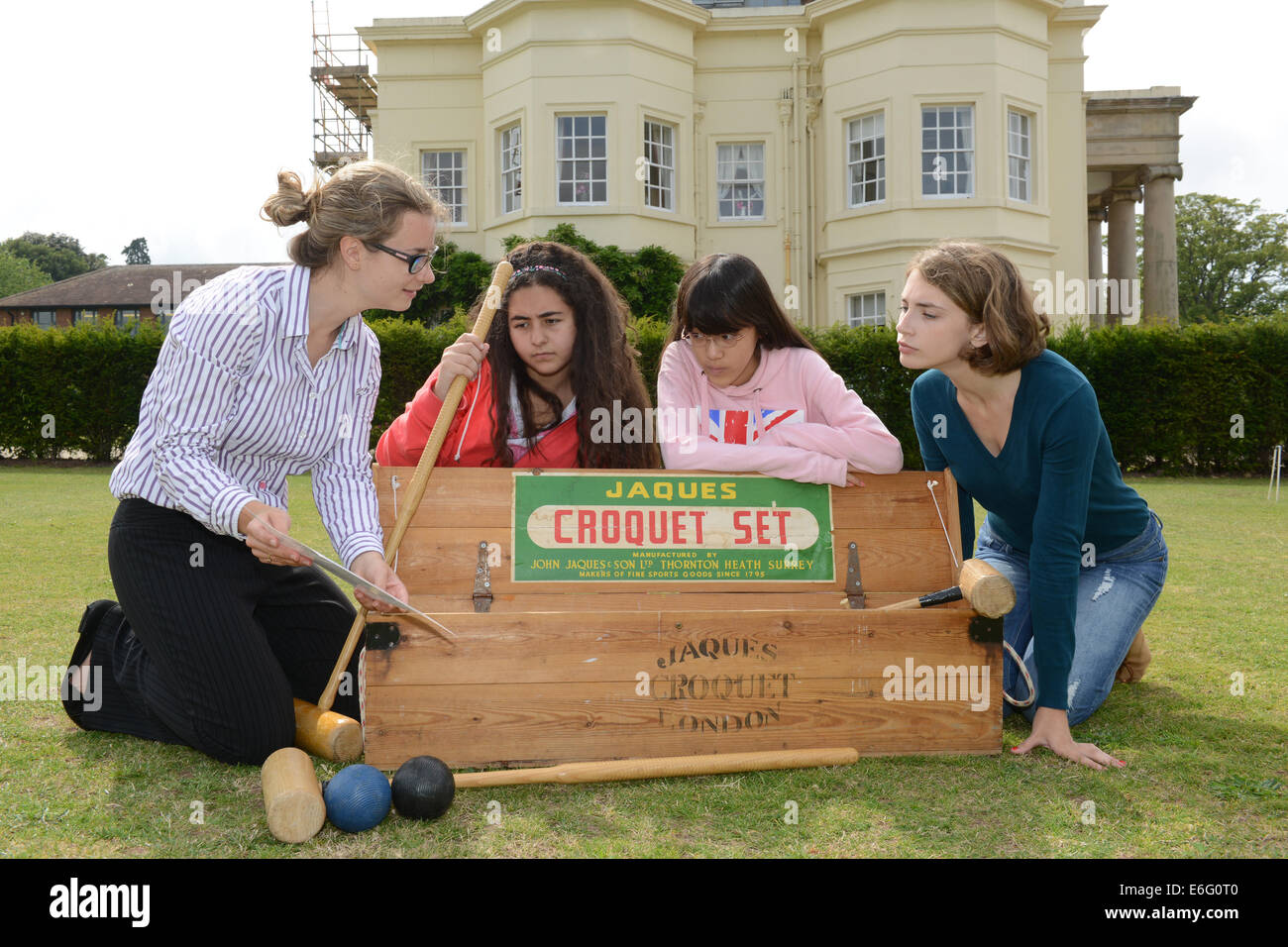 Concord College Acton Burnell Foreign students learning the rules of Croquet from Rachel Harnell, pastoral assistant LtoR  Amina Sharif (Saudi Arabia), Eleanor Ueda (Japan) and Olga Blinova (Russia). Stock Photo
