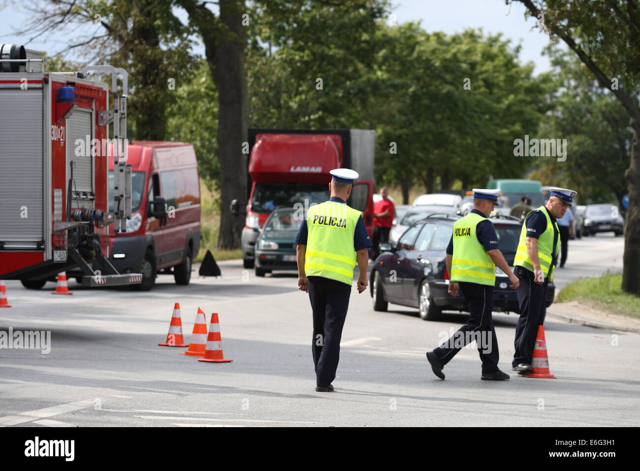 Gdansk, Poland 22nd, August 2014 72 y.o. man dead when his scooter hits the lorry on the crossroad in Kokoszki district of Gdansk. Police investigate on the crash site. Credit:  Michal Fludra/Alamy Live News Stock Photo