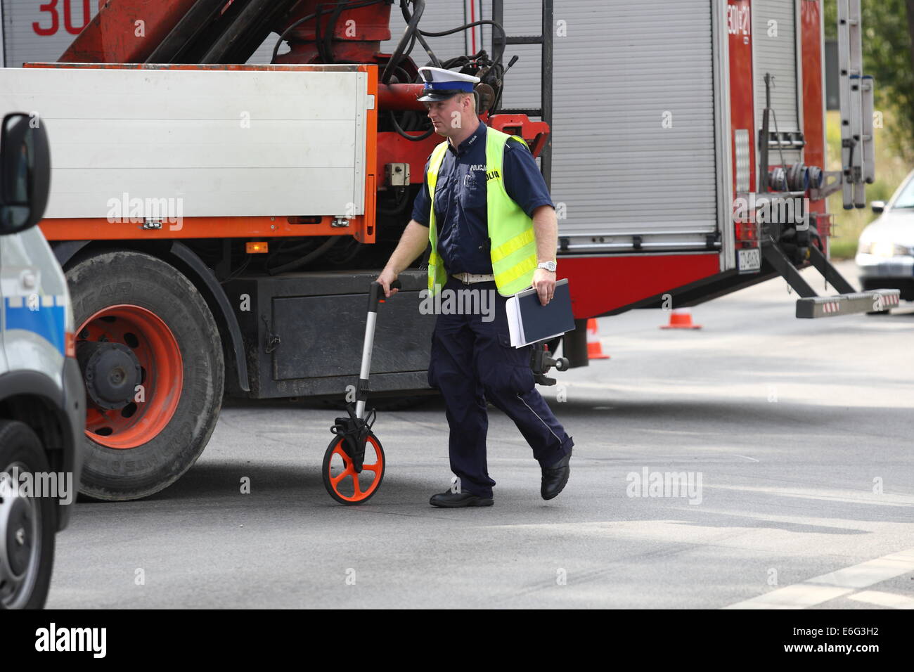 Gdansk, Poland 22nd, August 2014 72 y.o. man dead when his scooter hits the lorry on the crossroad in Kokoszki district of Gdansk. Police investigate on the crash site. Credit:  Michal Fludra/Alamy Live News Stock Photo