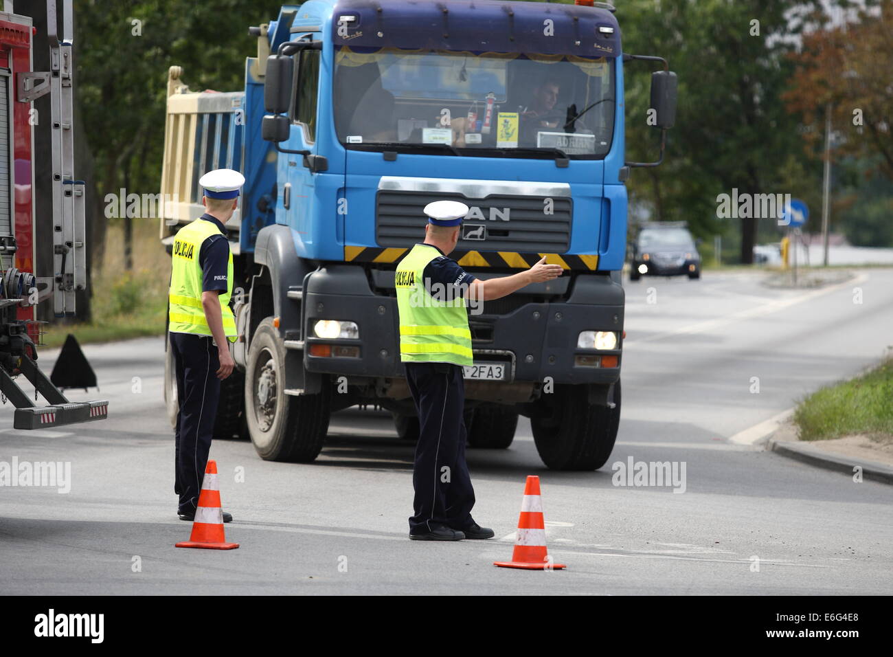 Gdansk, Poland 22nd, August 2014 72 y.o. man dead when his scooter hits the lorry on the crossroad in Kokoszki district of Gdansk. Police investigate on the crash site. Credit:  Michal Fludra/Alamy Live News Stock Photo