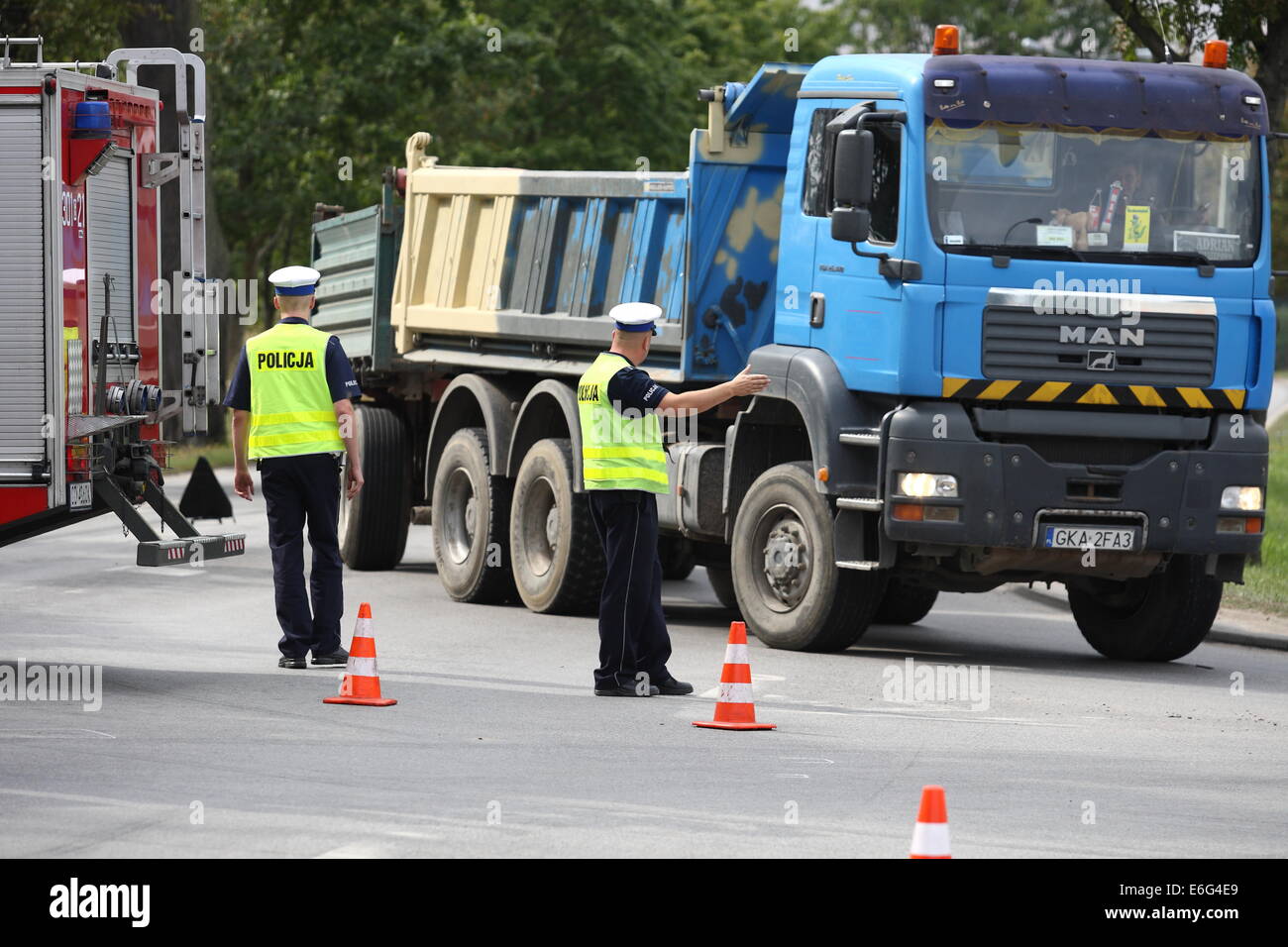 Gdansk, Poland 22nd, August 2014 72 y.o. man dead when his scooter hits the lorry on the crossroad in Kokoszki district of Gdansk. Police investigate on the crash site. Credit:  Michal Fludra/Alamy Live News Stock Photo