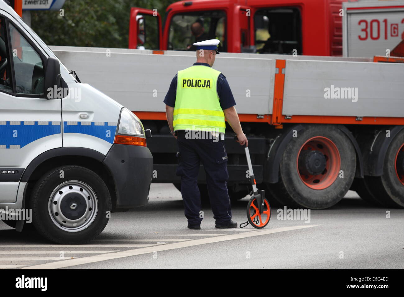 Gdansk, Poland 22nd, August 2014 72 y.o. man dead when his scooter hits the lorry on the crossroad in Kokoszki district of Gdansk. Police investigate on the crash site. Credit:  Michal Fludra/Alamy Live News Stock Photo