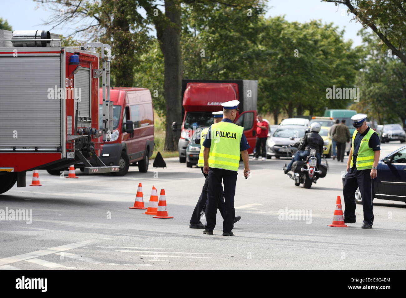 Gdansk, Poland 22nd, August 2014 72 y.o. man dead when his scooter hits the lorry on the crossroad in Kokoszki district of Gdansk. Police investigate on the crash site. Credit:  Michal Fludra/Alamy Live News Stock Photo