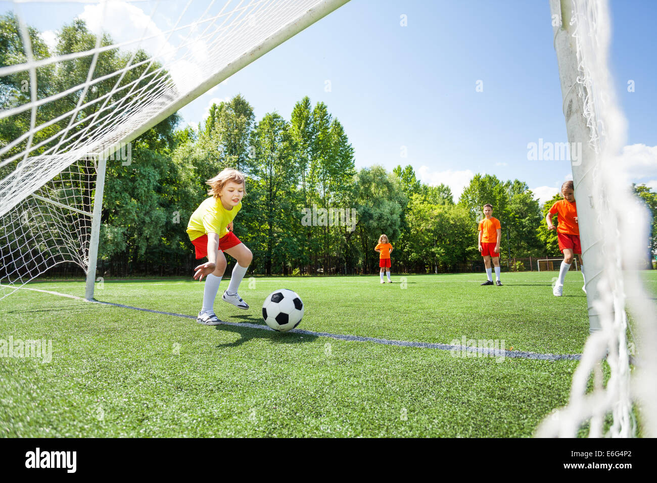 Boy tries to catch football thrown at woodwork Stock Photo Alamy
