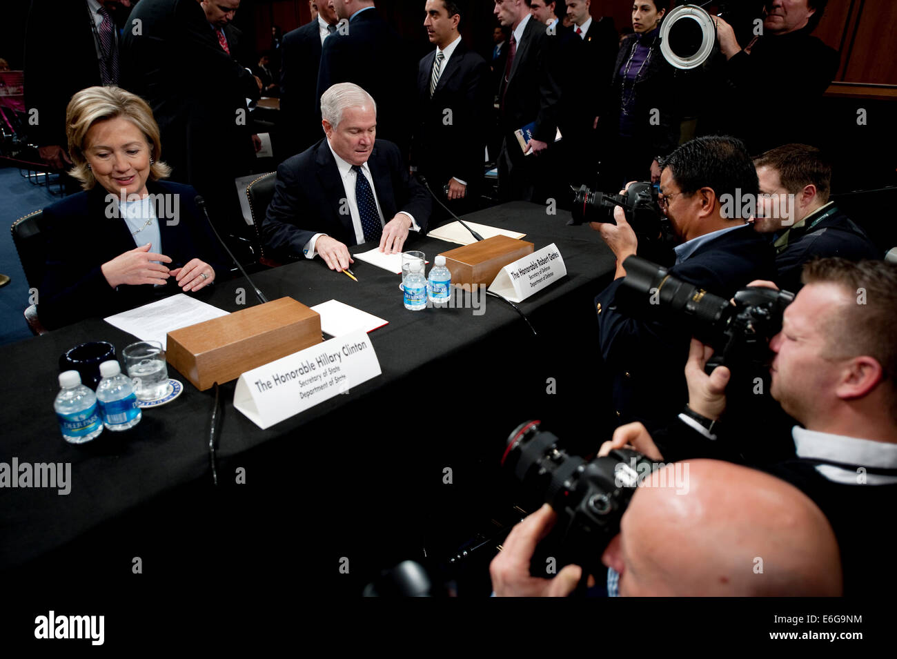 US Secretary of State Hillary Rodham Clinton and Secretary of Defense Robert M. Gates prepare to testify at the Senate Foreign Relations Committee on the troop serge sending an additional 30,000 troops to Afghanistan in the Hart Senate Office Building December 3, 2009 in Washington, DC. Stock Photo