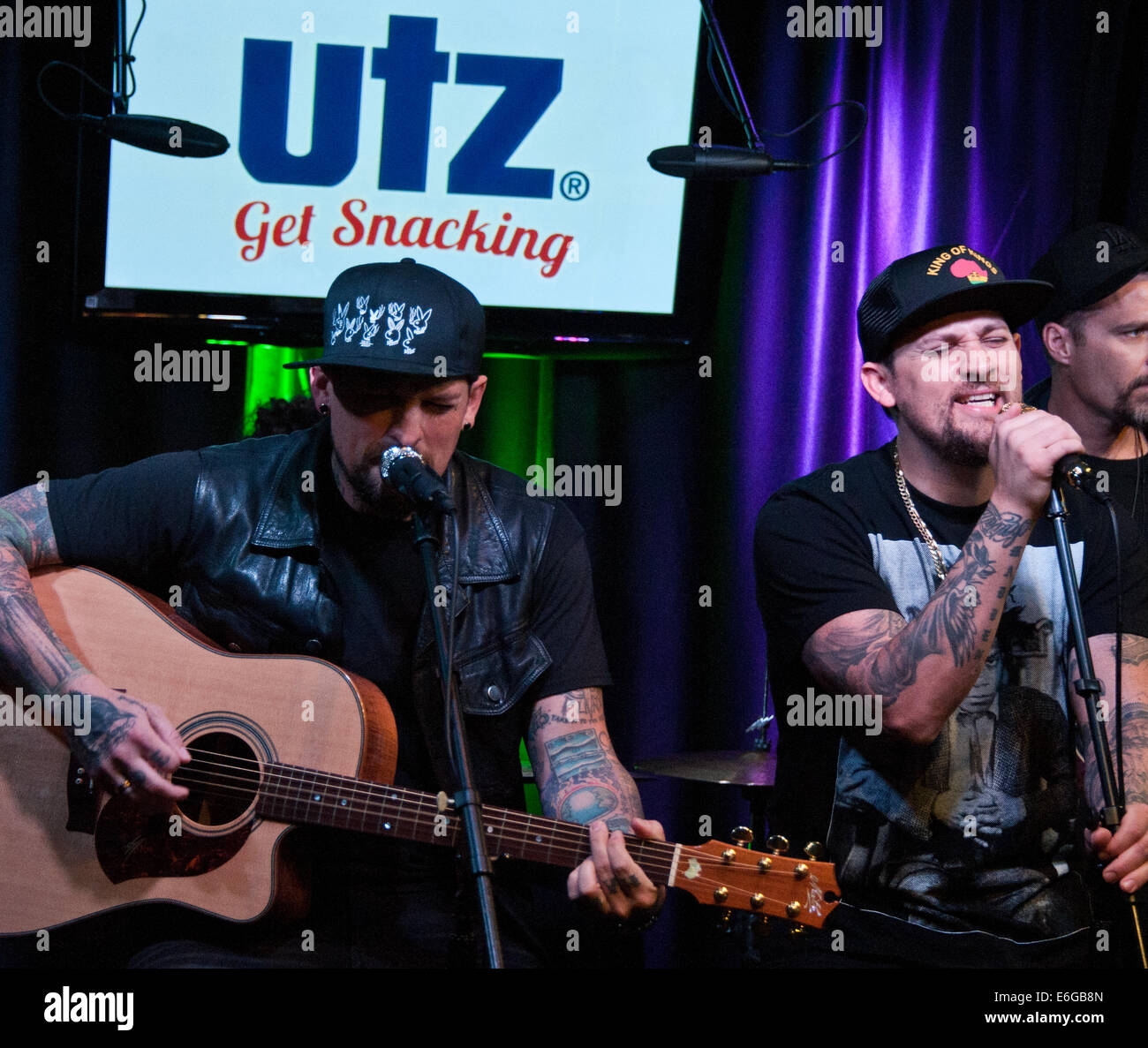 Bala Cynwyd, Pennsylvania, USA. 21st August, 2014. (L to R) Benji Madden and Joel Madden of American Pop Rock Duo The Madden Brothers Perform at Q102's Performance Theatre on August 21, 2014 in Bala Cynwyd, Pennsylvania, United States. Credit:  Paul Froggatt/Alamy Live News Stock Photo