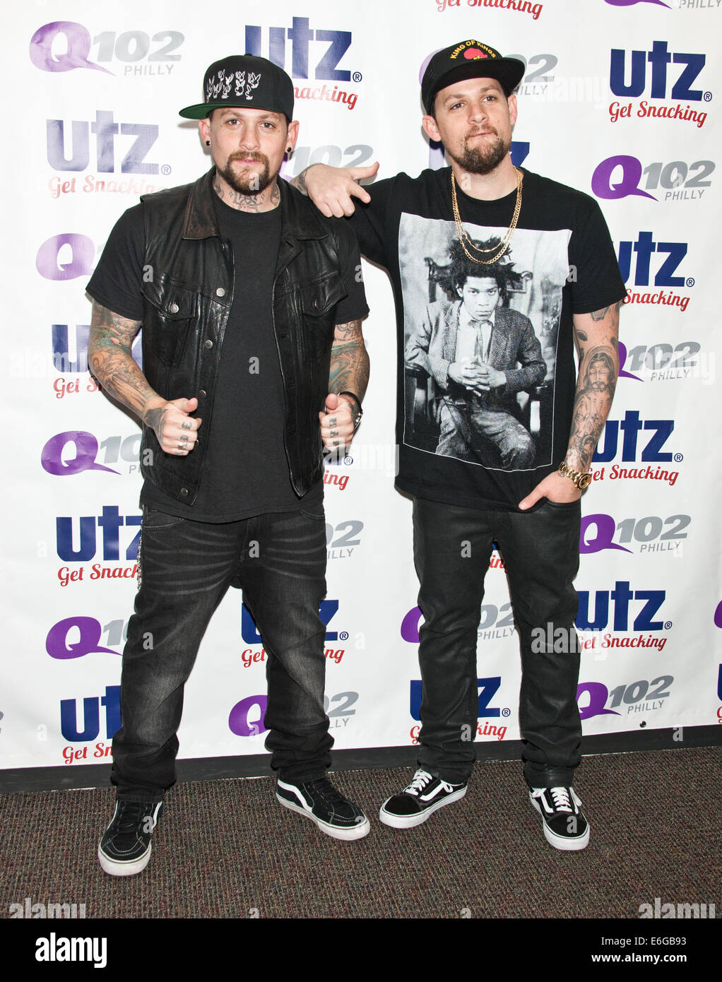 Bala Cynwyd, Pennsylvania, USA. 21st August, 2014. (L to R) Benji Madden and Joel Madden of American Pop Rock Duo The Madden Brothers Pose at Q102's Performance Theatre on August 21, 2014 in Bala Cynwyd, Pennsylvania, United States. Credit:  Paul Froggatt/Alamy Live News Stock Photo