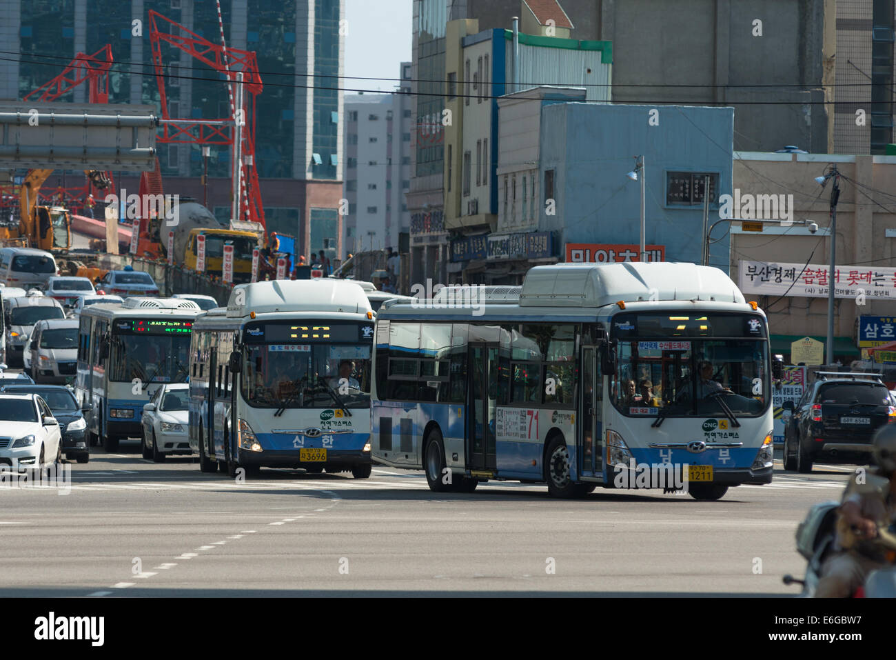 Buses on busy street in Busan, South Korea Stock Photo