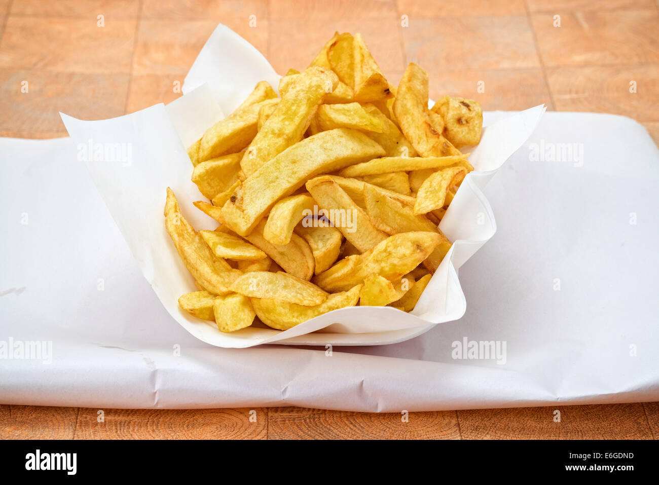 Chunky fries or chips served on a take away dish and paper Stock Photo