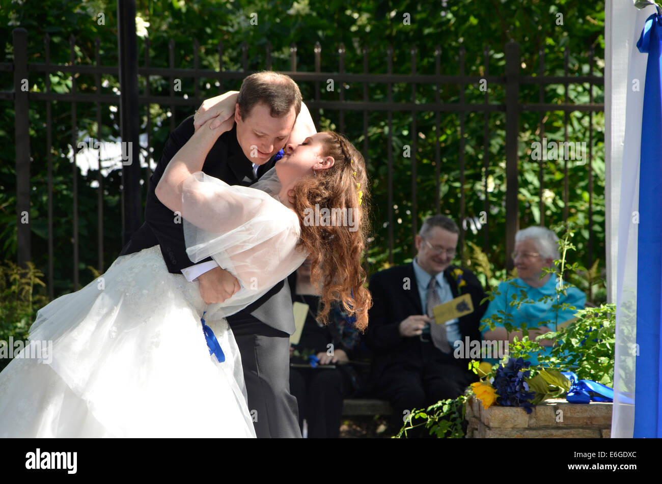 bride and groom kiss at their wedding Stock Photo Alamy