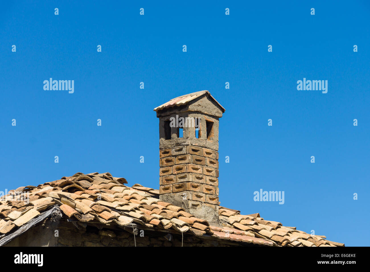 Old brick chimney against the blue sky Stock Photo - Alamy
