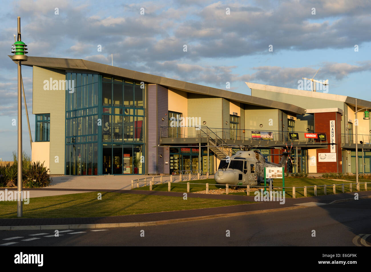 Main entrance to Portland Marina, UK, with a lynx helicopter on display that once flew from the former base, now the marina. Stock Photo