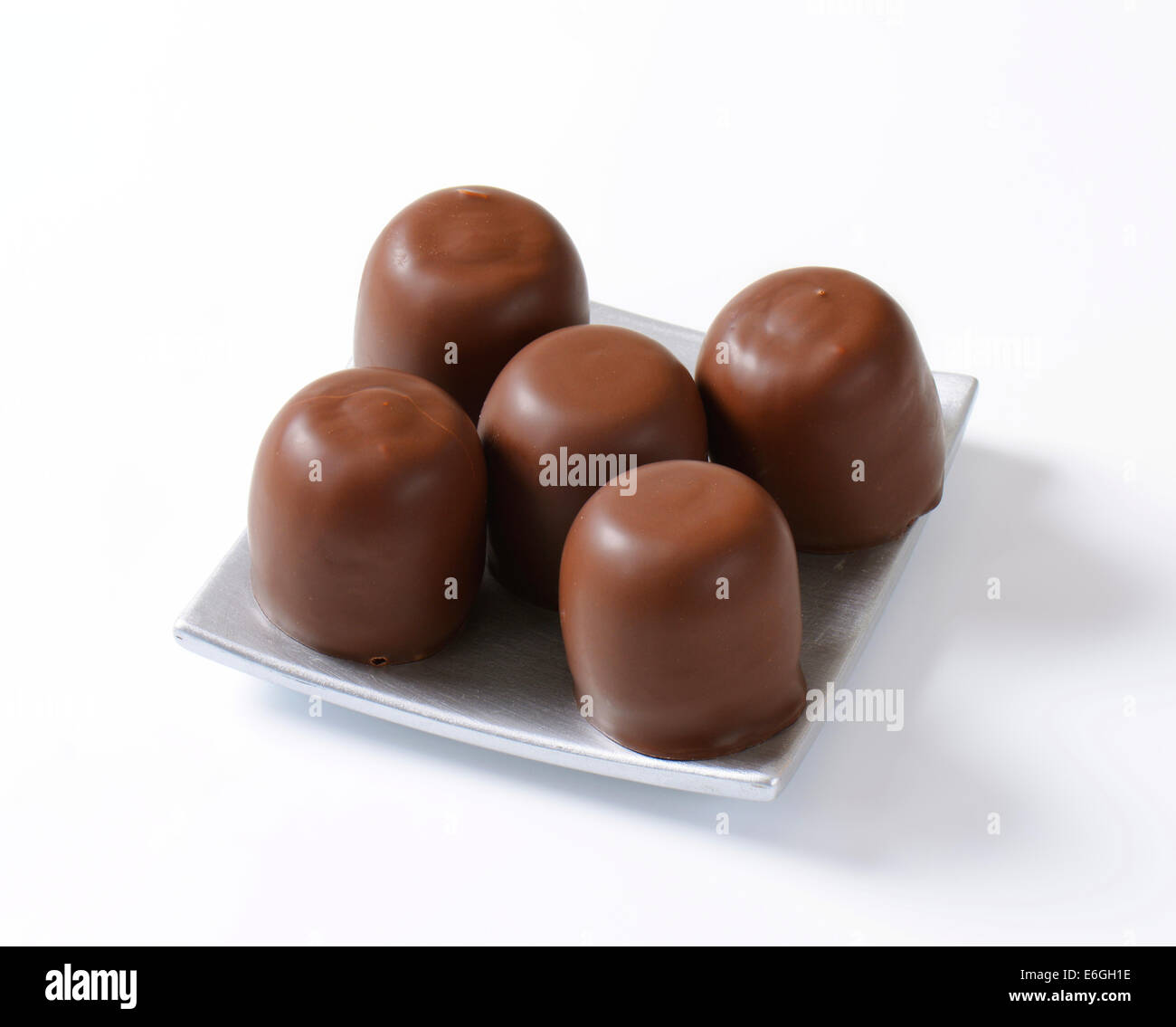 Marshmallows coated in milk chocolate Stock Photo Alamy