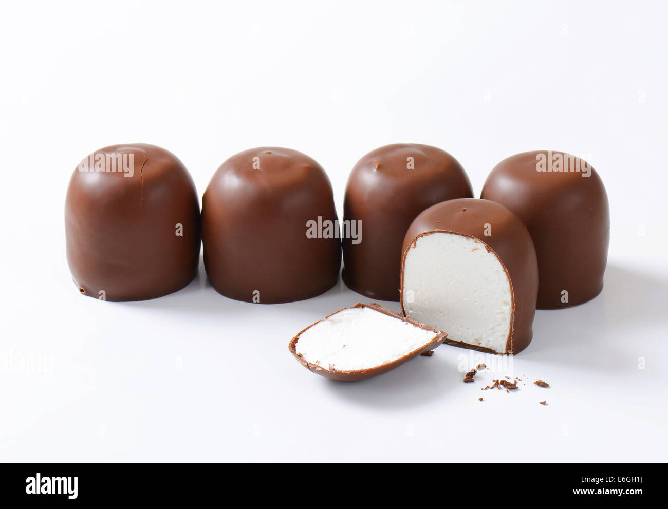 Marshmallows coated in milk chocolate Stock Photo Alamy