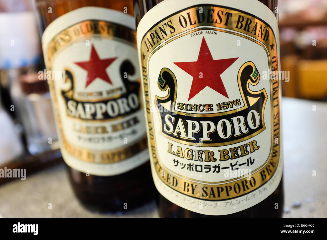 Two bottles of Japan-made Sapporo beer. Stock Photo