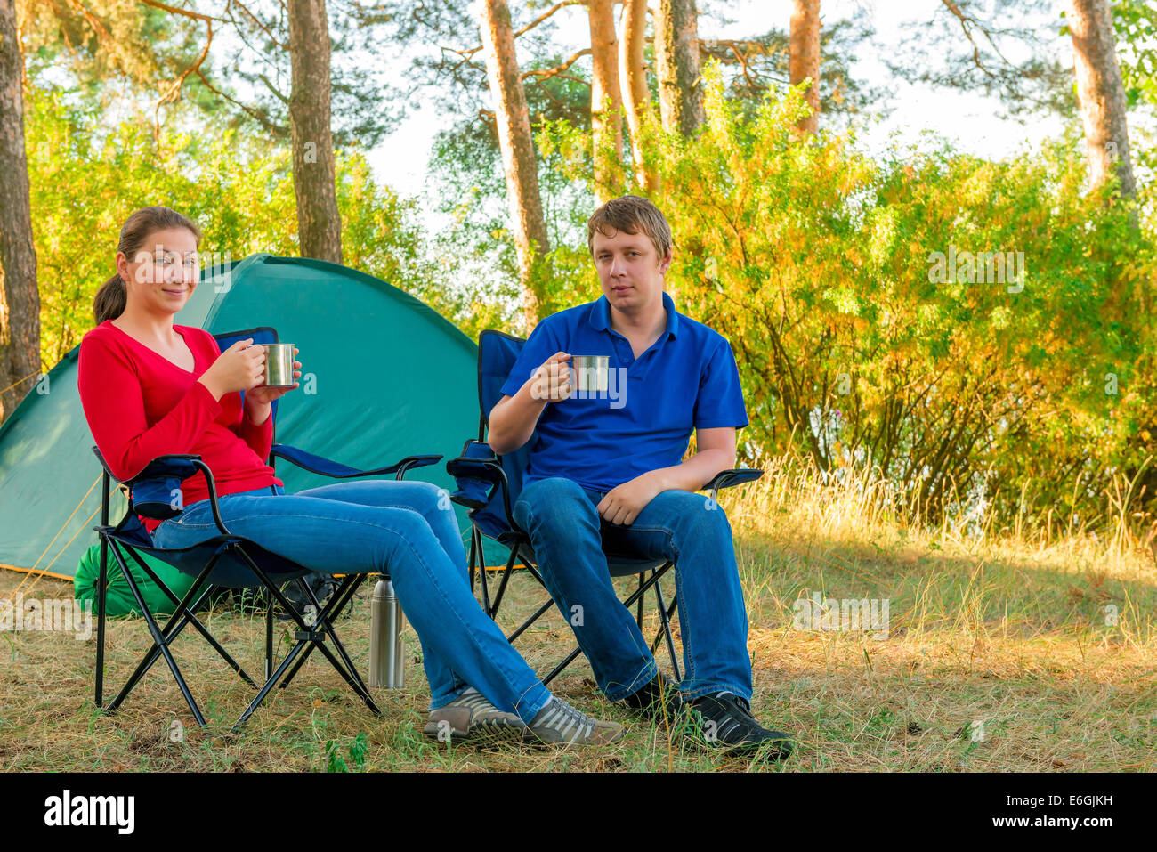 spouses drinking tea in the morning in a camp Stock Photo