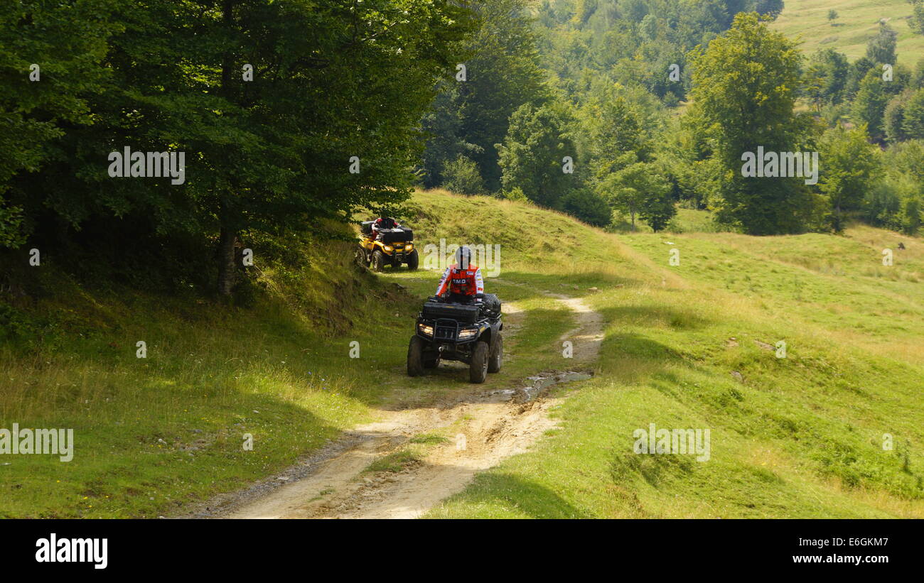 Driving ATVs in beautiful landscapes Stock Photo - Alamy